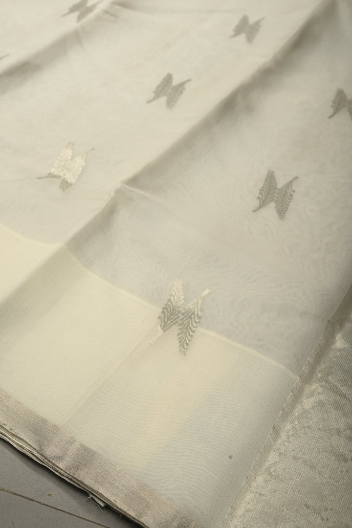 White Chanderi Silk Saree with Floral Silver Zari Buttas and Minimal Tissue Zari Border | SHOBITAM
