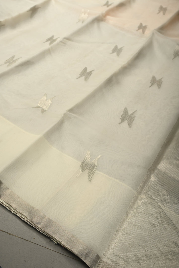 White Chanderi Silk Saree with Floral Silver Zari Buttas and Minimal Tissue Zari Border | SHOBITAM
