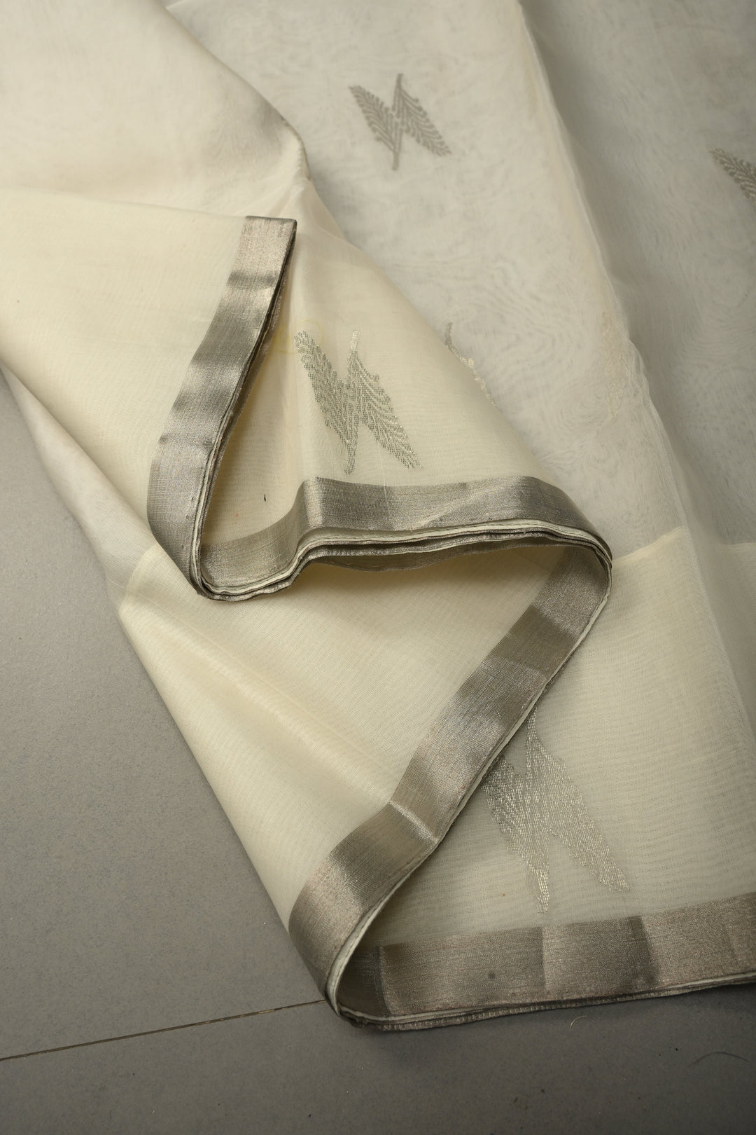 White Chanderi Silk Saree with Floral Silver Zari Buttas and Minimal Tissue Zari Border | SHOBITAM