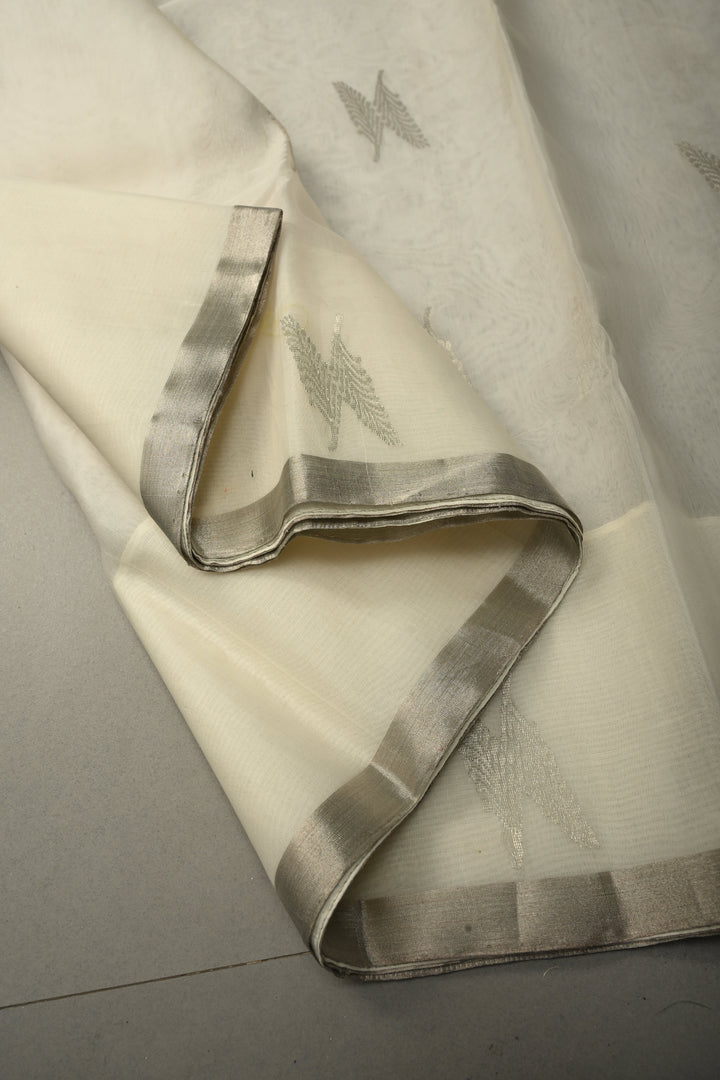 White Chanderi Silk Saree with Floral Silver Zari Buttas and Minimal Tissue Zari Border | SHOBITAM