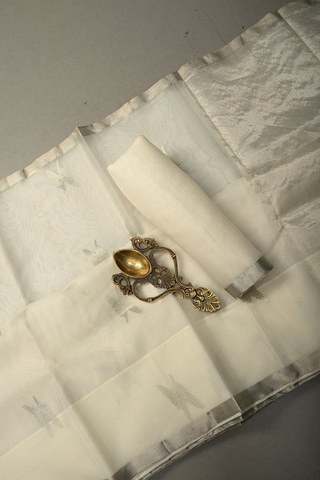 White Chanderi Silk Saree with Floral Silver Zari Buttas and Minimal Tissue Zari Border | SHOBITAM