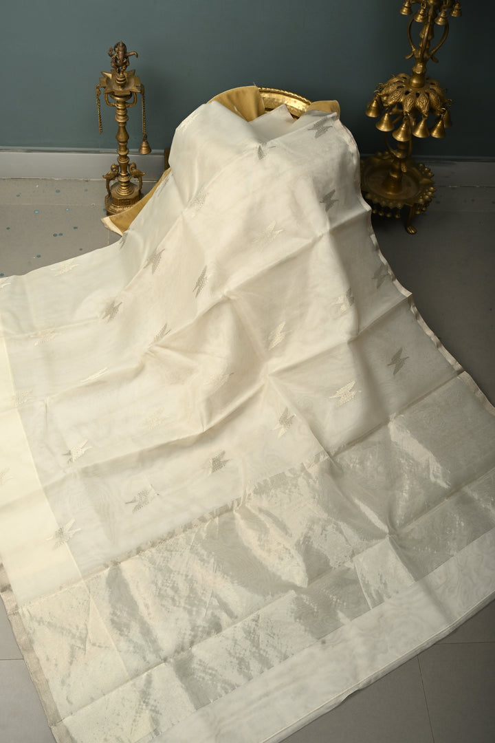 White Chanderi Silk Saree with Floral Silver Zari Buttas and Minimal Tissue Zari Border | SHOBITAM