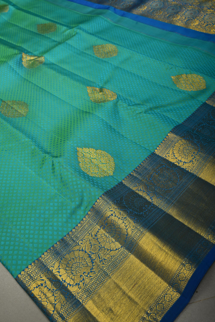Teal Green Self Brocade on Pure Kanjivaram Silk Handloom Saree with Leaf Motifs and Zari Border | SILK MARK CERTIFIED | SHOBITAM