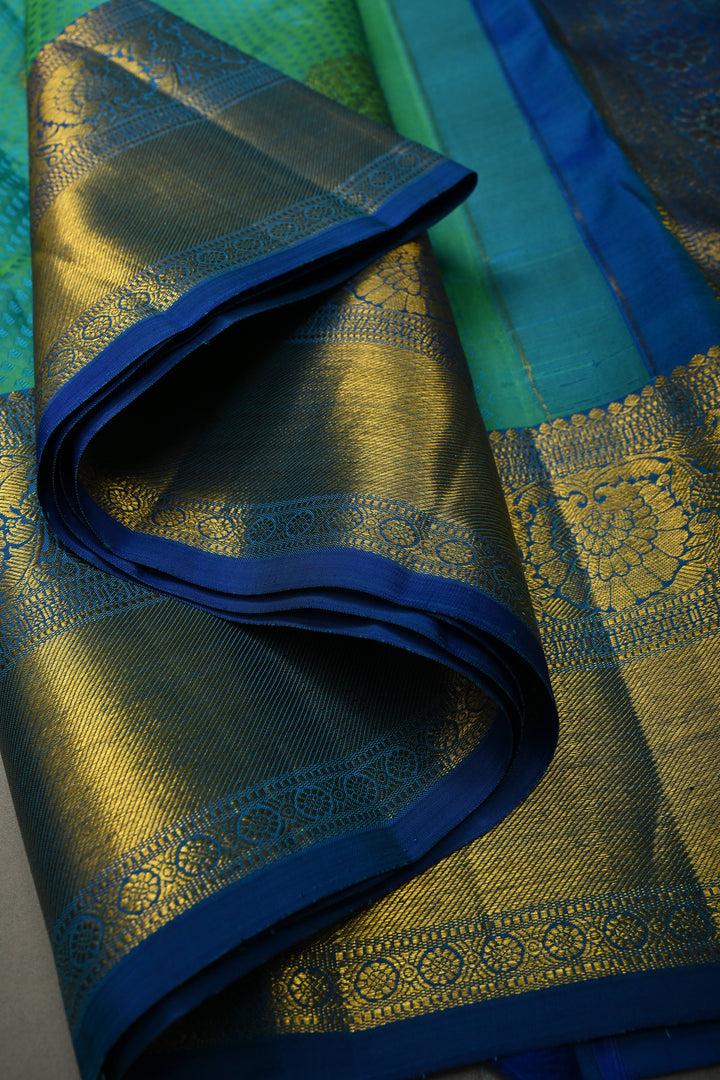 Teal Green Self Brocade on Pure Kanjivaram Silk Handloom Saree with Leaf Motifs and Zari Border | SILK MARK CERTIFIED | SHOBITAM