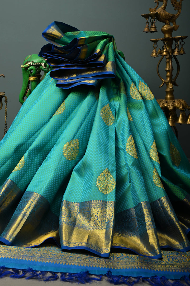 Teal Green Self Brocade on Pure Kanjivaram Silk Handloom Saree with Leaf Motifs and Zari Border | SILK MARK CERTIFIED | SHOBITAM