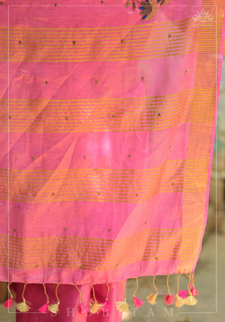 Bead and embroidery handwork on Tissue Linen Saree in Pink and Gold Tissue