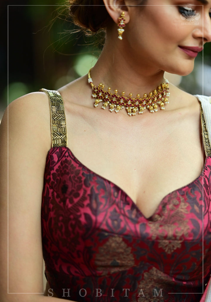 Maroon Brocade Blouse with Copper Cutdana Straps and Leaf Neckline