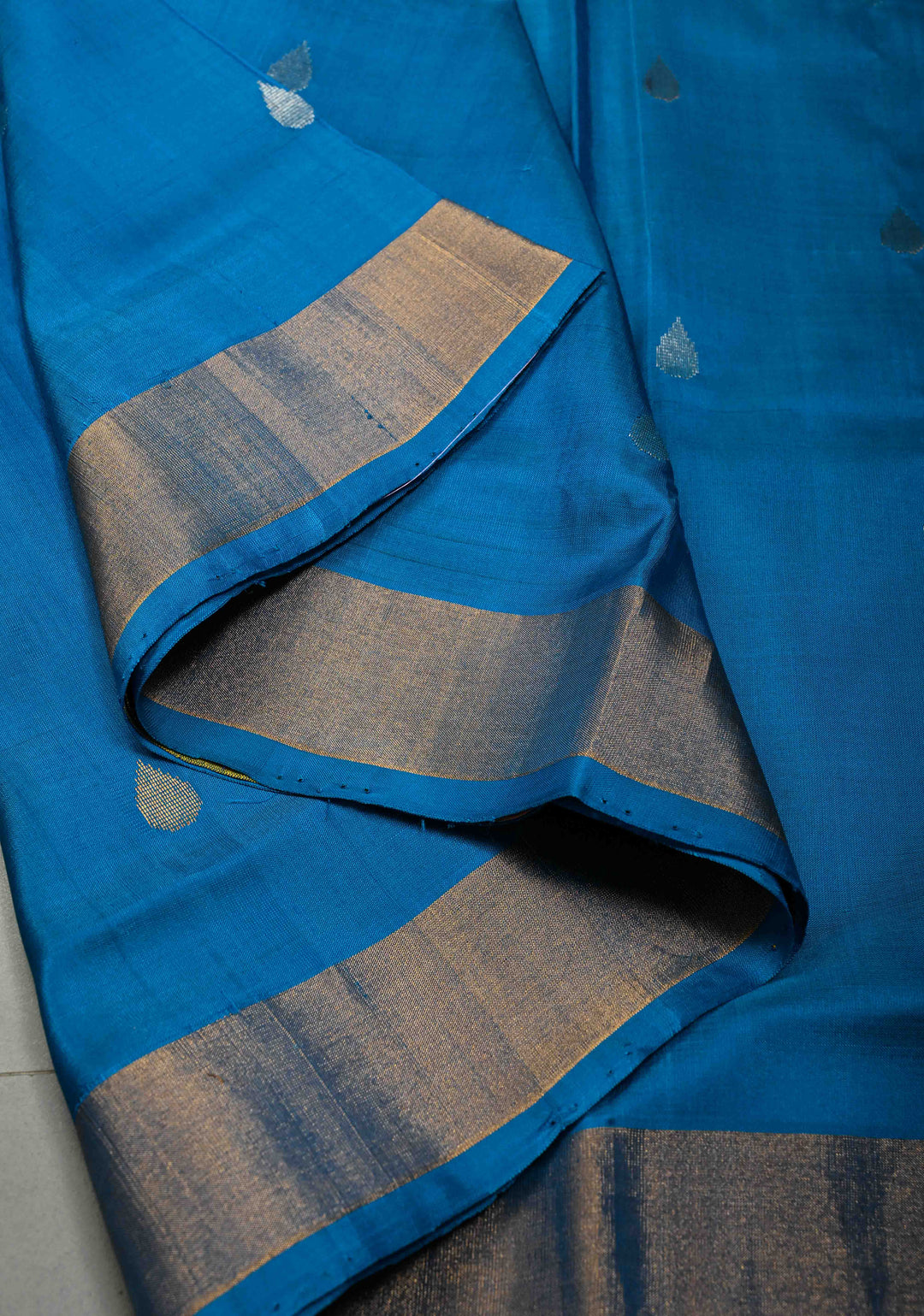 Copper Sulphate Blue Rangkaat Panel Design on Uppada Handloom Silk Saree with Sona Rupa Zari Buttas and Minimal Tissue Border| SILK MARK CERTIFIED | SHOBITAM