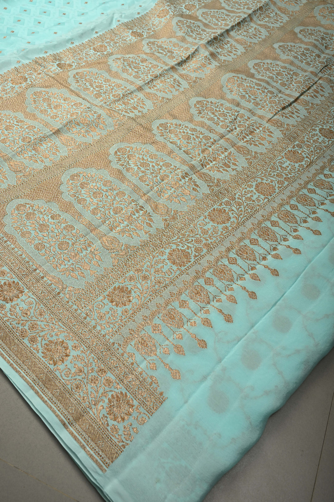 Cyan Blue Self Brocade Jaal on Banarasi Georgette Silk Saree with Antique Zari Buttis and Zari Border | SILK MARK CERTIFIED | SHOBITAM