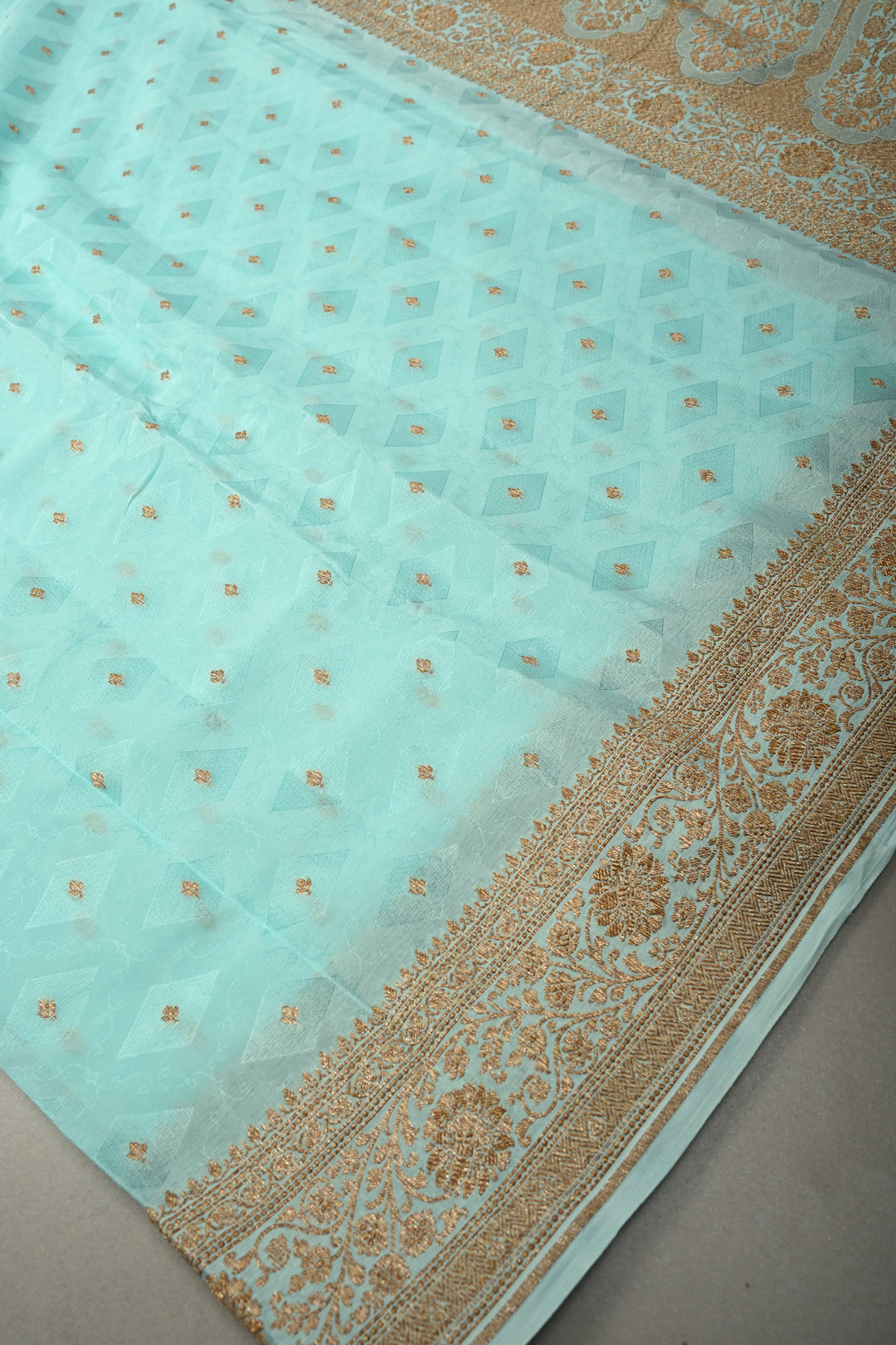 Cyan Blue Self Brocade Jaal on Banarasi Georgette Silk Saree with Antique Zari Buttis and Zari Border | SILK MARK CERTIFIED | SHOBITAM