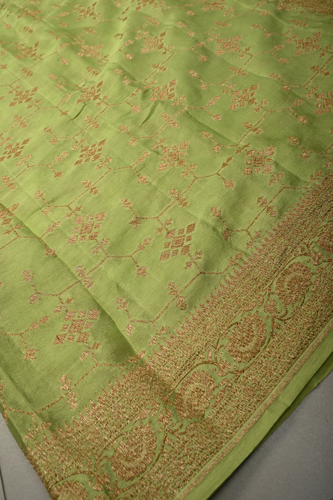 Dusty Pista Green Banarasi Crepe Georgette Silk Saree with Antique Geometric Jaal and Oxidized Zari Border | SILK MARK CERTIFIED | SHOBITAM
