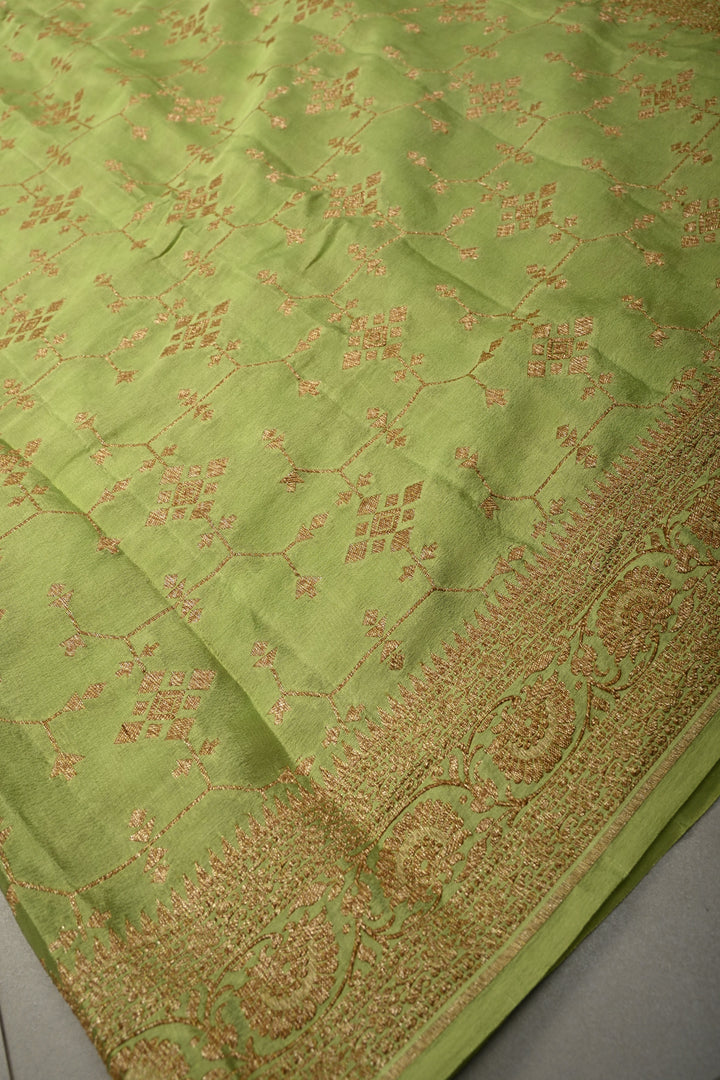 Dusty Pista Green Banarasi Crepe Georgette Silk Saree with Antique Geometric Jaal and Oxidized Zari Border | SILK MARK CERTIFIED | SHOBITAM