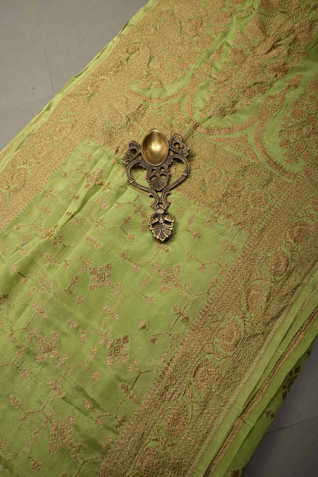 Dusty Pista Green Banarasi Crepe Georgette Silk Saree with Antique Geometric Jaal and Oxidized Zari Border | SILK MARK CERTIFIED | SHOBITAM