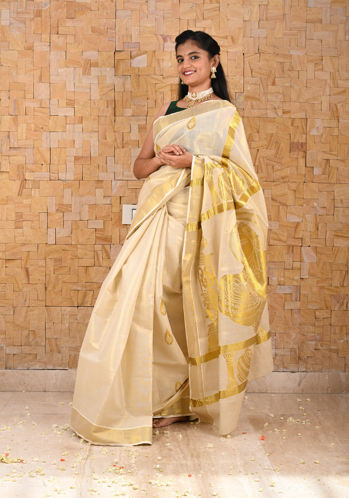 Unique Kerala Kasavu Saree in Tissue Cotton with Zari Buttas and Baby Krishna Theme on Pallu