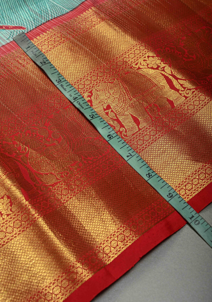 Aqua Blue Pure Kanjivaram Silk Saree with Feather Digital Print and Red Contrast Zari Border | SILK MARK CERTIFIED | SHOBITAM