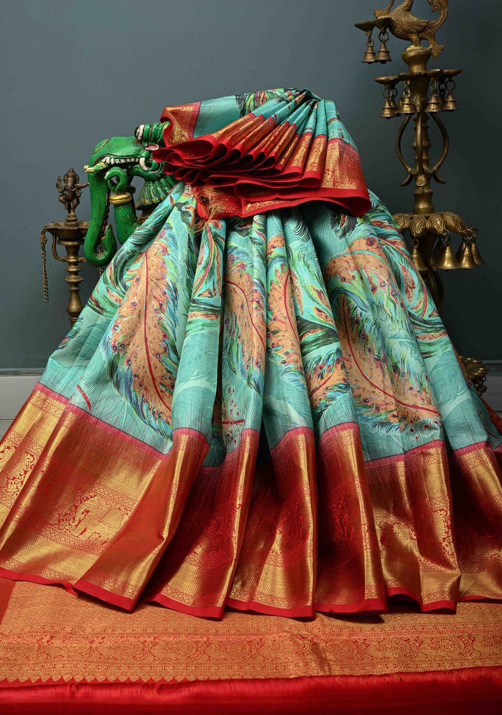 Aqua Blue Pure Kanjivaram Silk Saree with Feather Digital Print and Red Contrast Zari Border | SILK MARK CERTIFIED | SHOBITAM