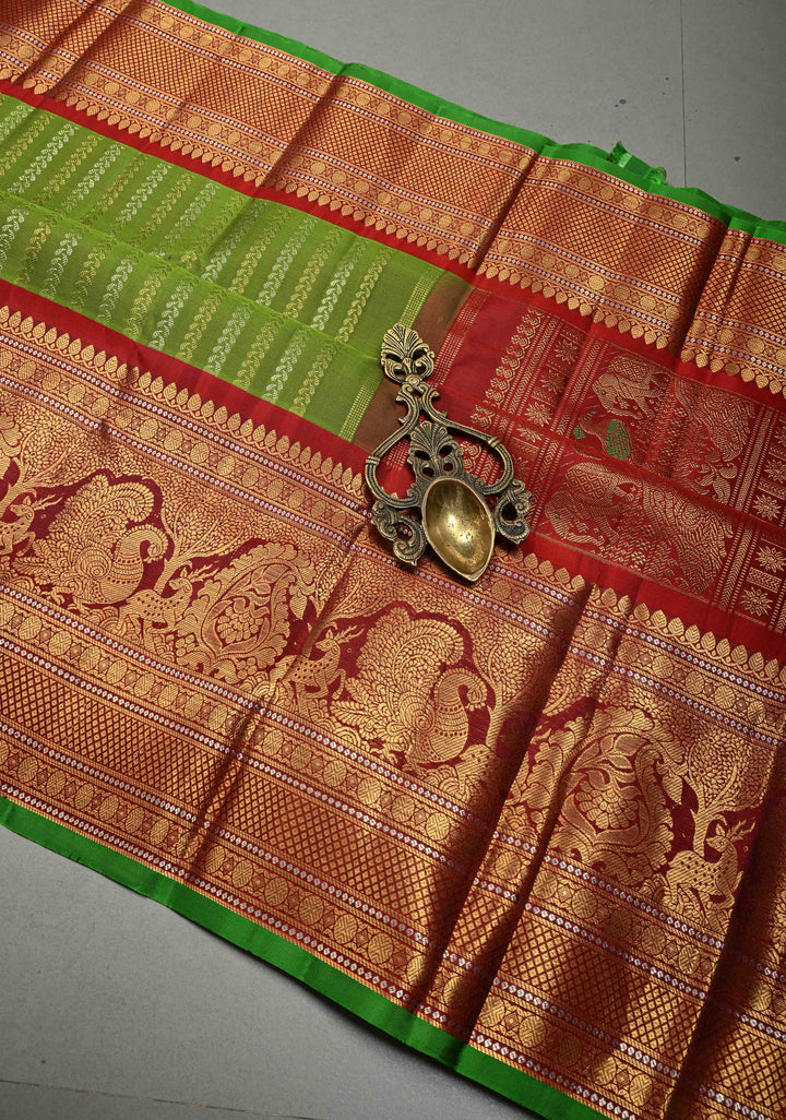 Deep Lime Green Pure Gadwal Silk Saree with Gold & Silver Ornate Zari Stripes and Contrast Wide Zari Border | SILK MARK CERTIFIED | SHOBITAM