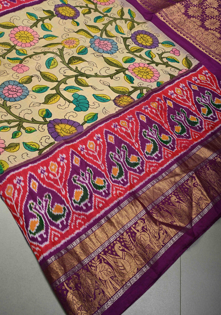 Authentic Pen Kalamkari Handpainted on Ikkat Pure Silk Saree with Contrast Ikkat Panel and Kanchi Border | SILK MARK CERTIFIED | SHOBITAM
