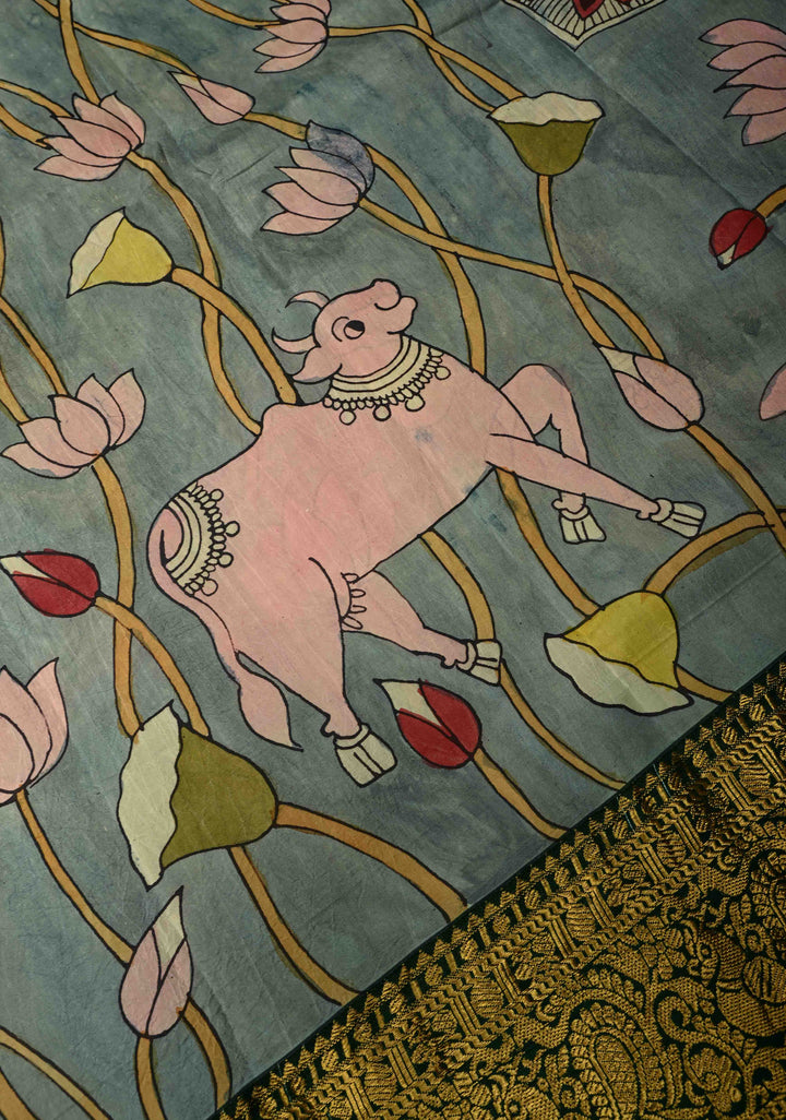 Pichwai and Srinathji Theme :  Authentic Pen Kalamkari Handpainted on Pure Kanjivaram Silk Saree with Contrast Zari Border | SILK MARK CERTIFIED | SHOBITAM