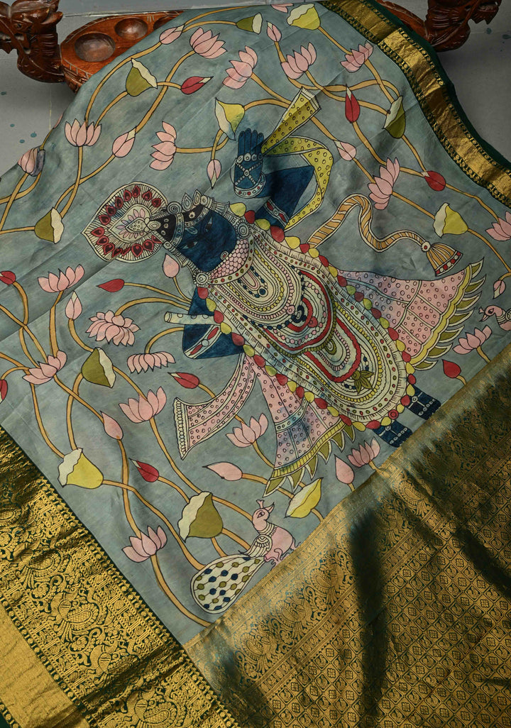 Pichwai and Srinathji Theme :  Authentic Pen Kalamkari Handpainted on Pure Kanjivaram Silk Saree with Contrast Zari Border | SILK MARK CERTIFIED | SHOBITAM