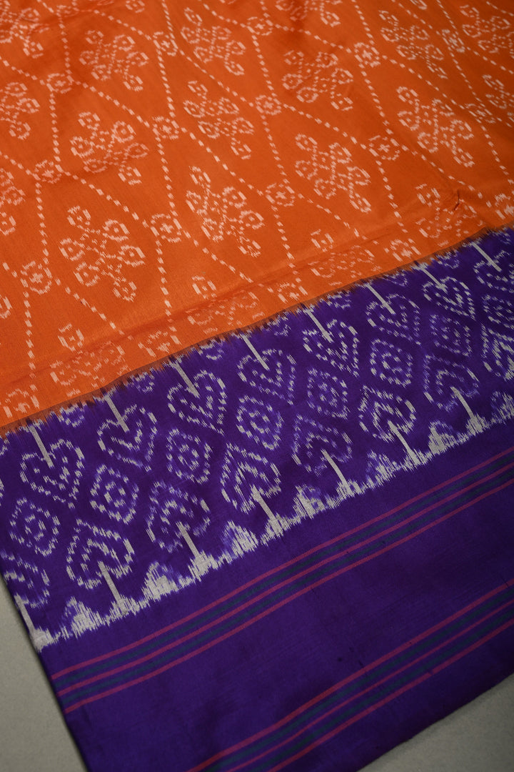 Rust Orange Pochampally Ikkat Pure Silk Saree with Kolam Design and Purple Panel on Contrast Border | SILK MARK CERTIFIED | SHOBITAM