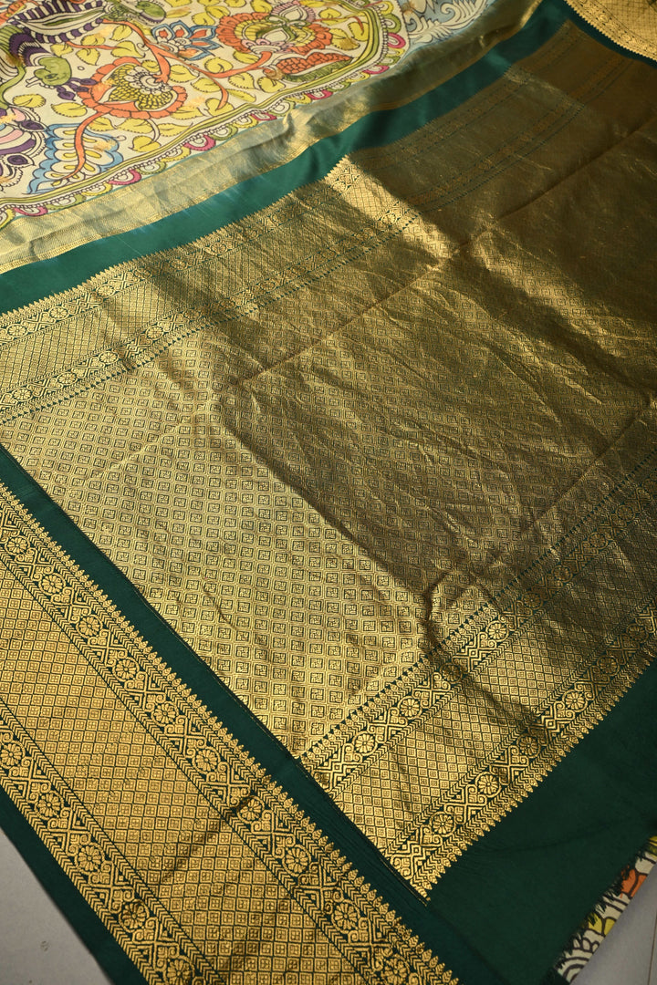 Peacock-Floral Theme : Light Sage Green Authentic Pen Kalamkari Handpainted on Pure Kanjivaram Silk Saree with Contrast Zari Border | SILK MARK CERTIFIED | SHOBITAM