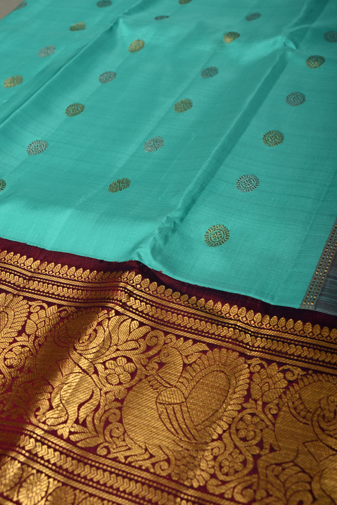 Teal Korvai Gadwal Silk Saree with Gold-Silver Floral Zari Buttas and Two Tone Contrast Wide Zari Border | SILK MARK CERTIFIED | SHOBITAM