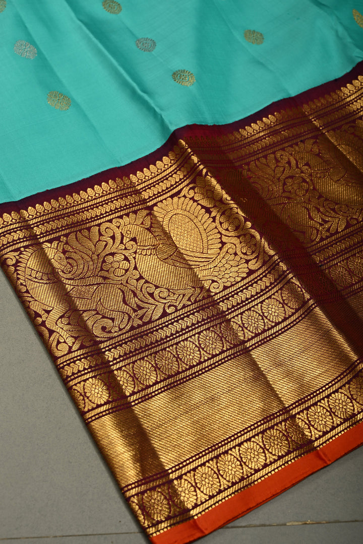 Teal Korvai Gadwal Silk Saree with Gold-Silver Floral Zari Buttas and Two Tone Contrast Wide Zari Border | SILK MARK CERTIFIED | SHOBITAM