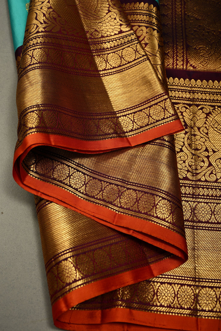Teal Korvai Gadwal Silk Saree with Gold-Silver Floral Zari Buttas and Two Tone Contrast Wide Zari Border | SILK MARK CERTIFIED | SHOBITAM