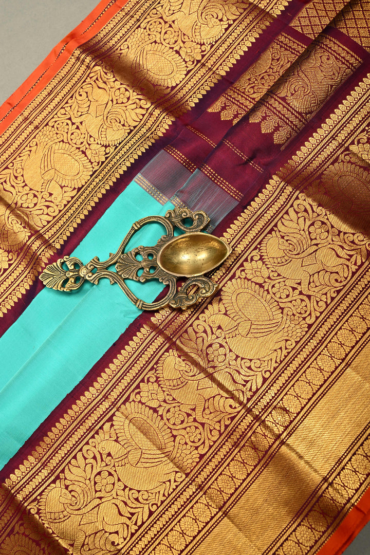 Teal Korvai Gadwal Silk Saree with Gold-Silver Floral Zari Buttas and Two Tone Contrast Wide Zari Border | SILK MARK CERTIFIED | SHOBITAM