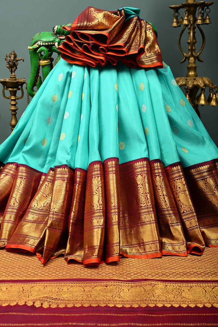 Teal Korvai Gadwal Silk Saree with Gold-Silver Floral Zari Buttas and Two Tone Contrast Wide Zari Border | SILK MARK CERTIFIED | SHOBITAM