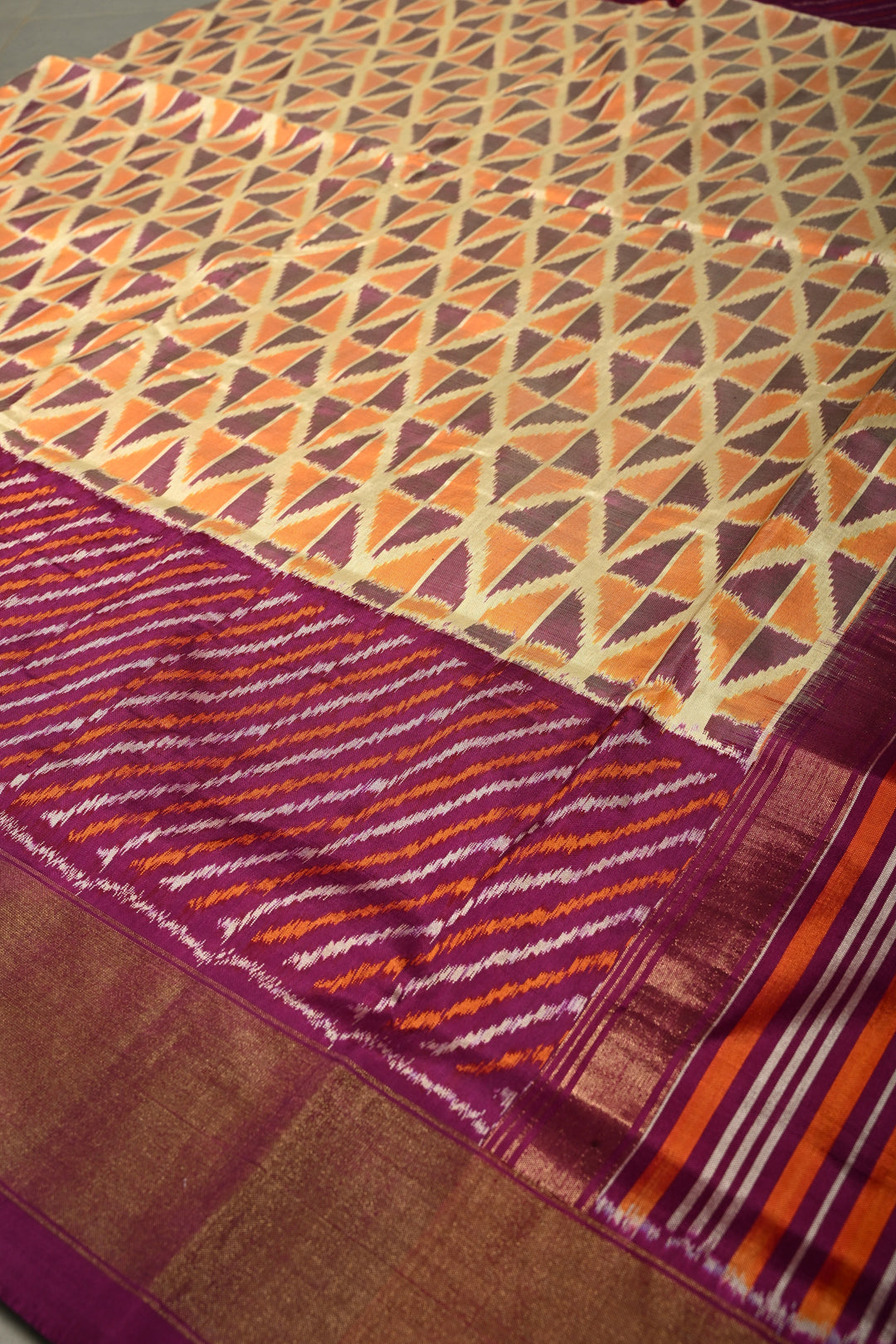 Muted Yellow Pochampally Ikkat Pure Silk Saree with Kente Design and Diagonal Stripes Contrast Panel on Tissue Zari Border  | SILK MARK CERTIFIED | SHOBITAM