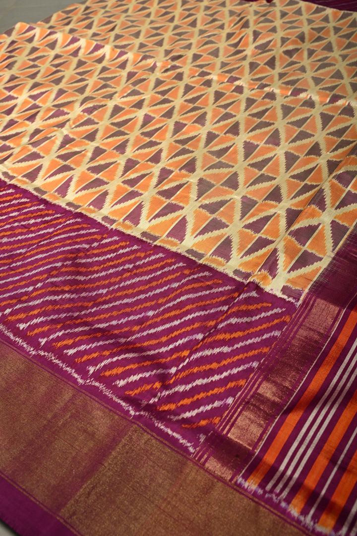 Muted Yellow Pochampally Ikkat Pure Silk Saree with Kente Design and Diagonal Stripes Contrast Panel on Tissue Zari Border  | SILK MARK CERTIFIED | SHOBITAM