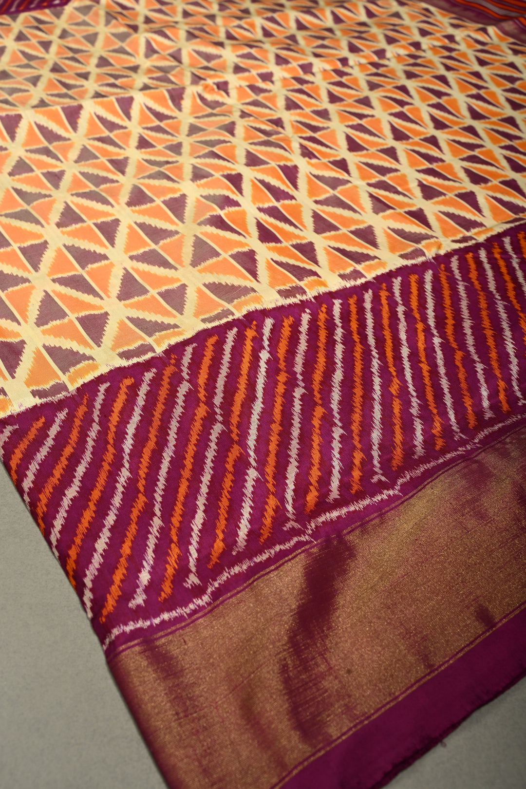 Muted Yellow Pochampally Ikkat Pure Silk Saree with Kente Design and Diagonal Stripes Contrast Panel on Tissue Zari Border  | SILK MARK CERTIFIED | SHOBITAM