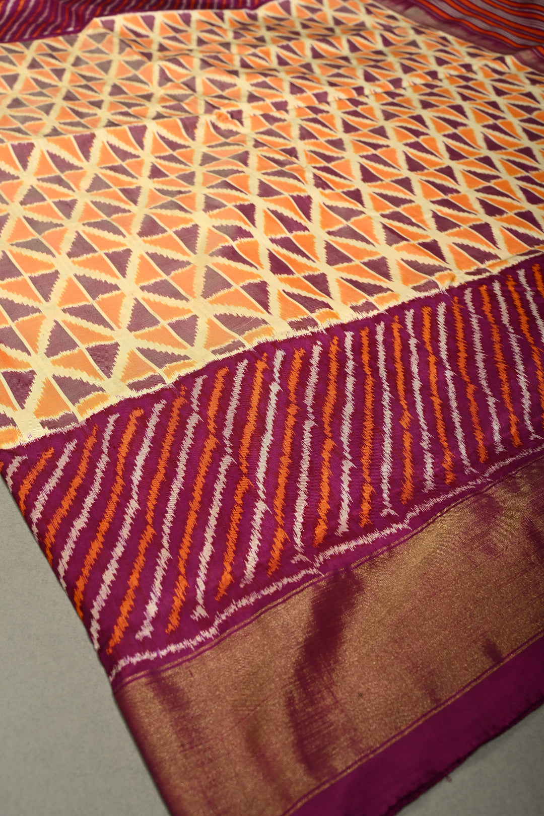 Muted Yellow Pochampally Ikkat Pure Silk Saree with Kente Design and Diagonal Stripes Contrast Panel on Tissue Zari Border  | SILK MARK CERTIFIED | SHOBITAM