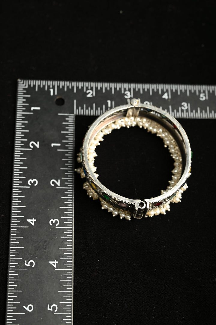 Multicolor Fiza Bangle in Brass-stones and pearls with an Antique Silver Polish