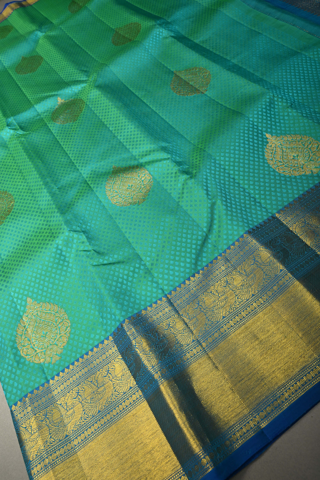 Blue-Green Dual Tone Self Brocade on Pure Kanjivaram Silk Handloom Saree with Damask Buttas and Zari Border| SILK MARK CERTIFIED | SHOBITAM