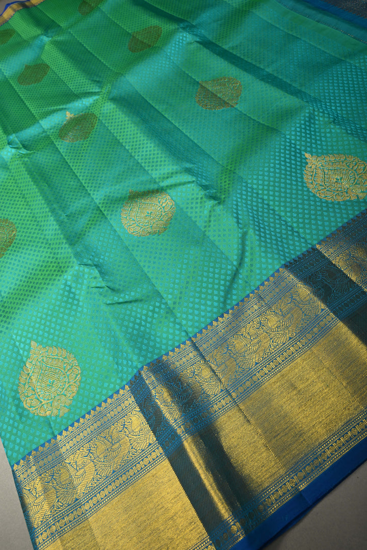 Blue-Green Dual Tone Self Brocade on Pure Kanjivaram Silk Handloom Saree with Damask Buttas and Zari Border| SILK MARK CERTIFIED | SHOBITAM