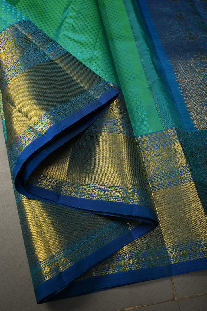 Blue-Green Dual Tone Self Brocade on Pure Kanjivaram Silk Handloom Saree with Damask Buttas and Zari Border| SILK MARK CERTIFIED | SHOBITAM