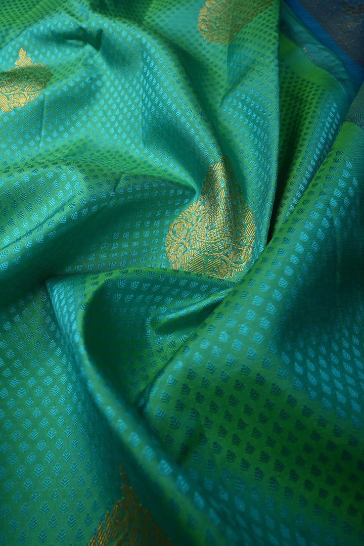 Blue-Green Dual Tone Self Brocade on Pure Kanjivaram Silk Handloom Saree with Damask Buttas and Zari Border| SILK MARK CERTIFIED | SHOBITAM
