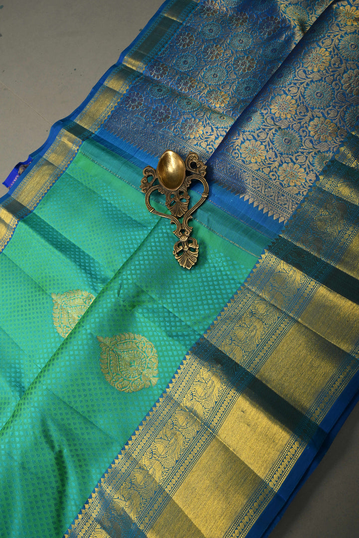 Blue-Green Dual Tone Self Brocade on Pure Kanjivaram Silk Handloom Saree with Damask Buttas and Zari Border| SILK MARK CERTIFIED | SHOBITAM