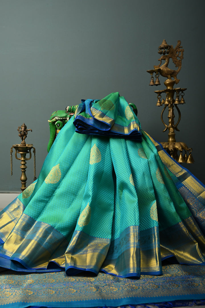 Blue-Green Dual Tone Self Brocade on Pure Kanjivaram Silk Handloom Saree with Damask Buttas and Zari Border| SILK MARK CERTIFIED | SHOBITAM