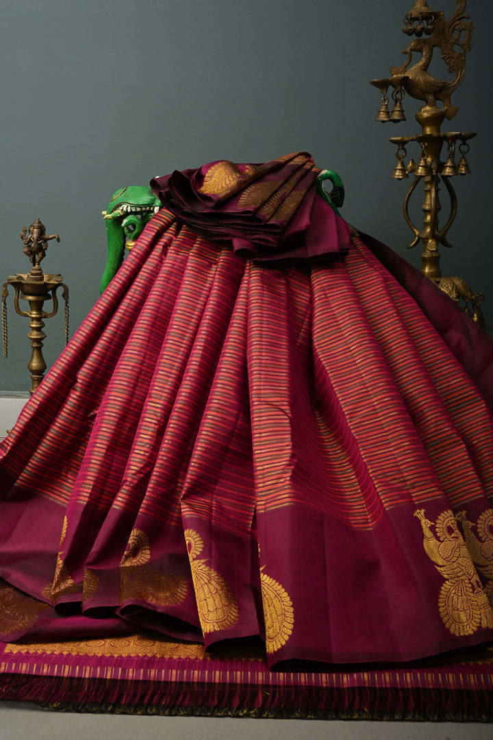 Multicolor Pure Kanjivaram Silk Handloom Saree with Horizontal Stripes and Distinct Twin Peacock Zari Motifs on Plum Border  | SILK MARK CERTIFIED | SHOBITAM