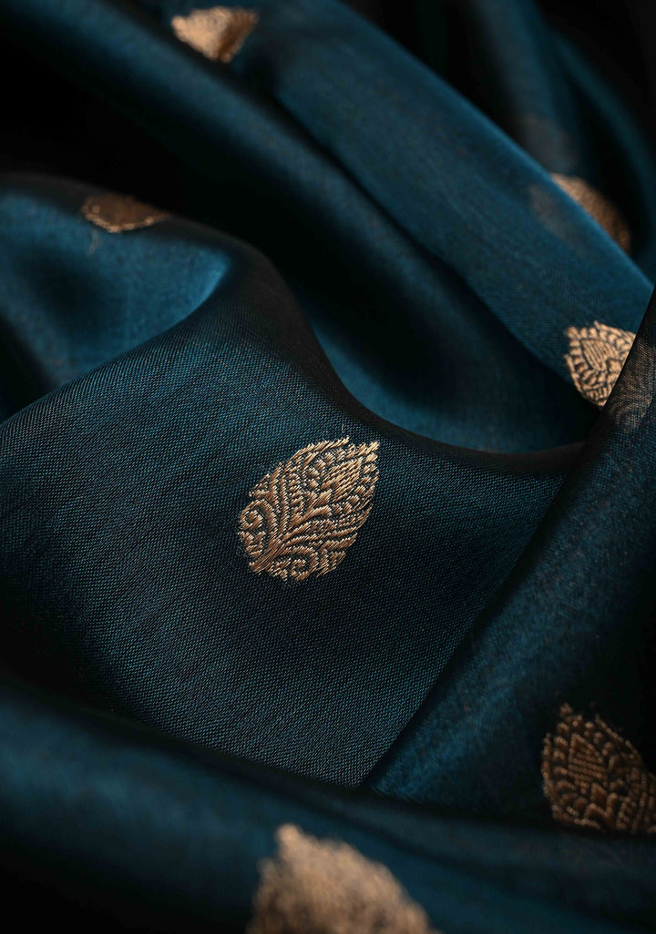 Peacock Blue Pure Banarasi Organza Tissue Silk Saree with Floral Zari Buttas and Contrast 2 Tone Zari Border | SILK MARK CERTIFIED | SHOBITAM