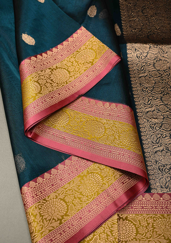 Peacock Blue Pure Banarasi Organza Tissue Silk Saree with Floral Zari Buttas and Contrast 2 Tone Zari Border | SILK MARK CERTIFIED | SHOBITAM