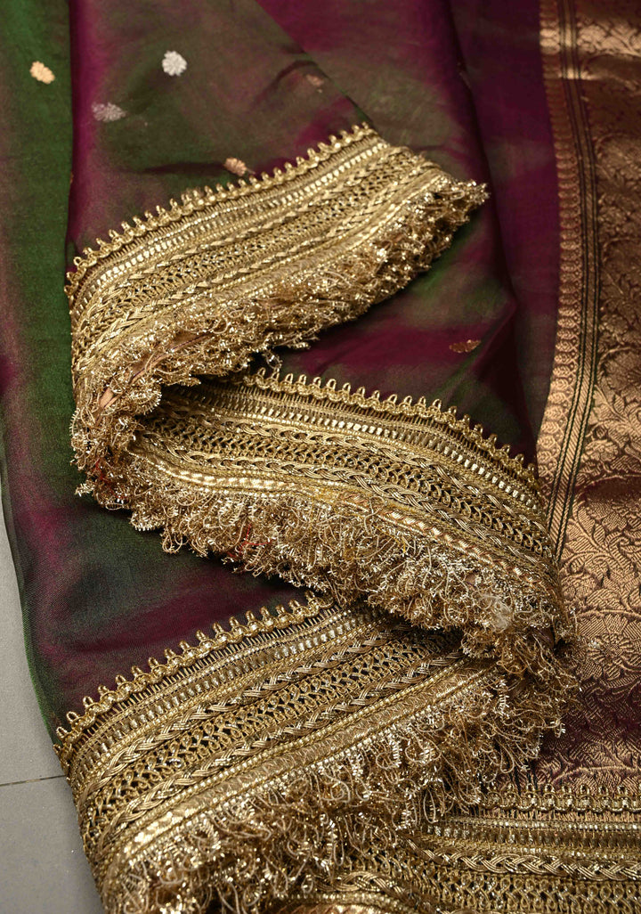 Purple-Green Dual tone Organza Tissue Silk Saree with Sona Rupa Zari Buttas and Fancy Lace Trim Border | SILK MARK CERTIFIED | SHOBITAM