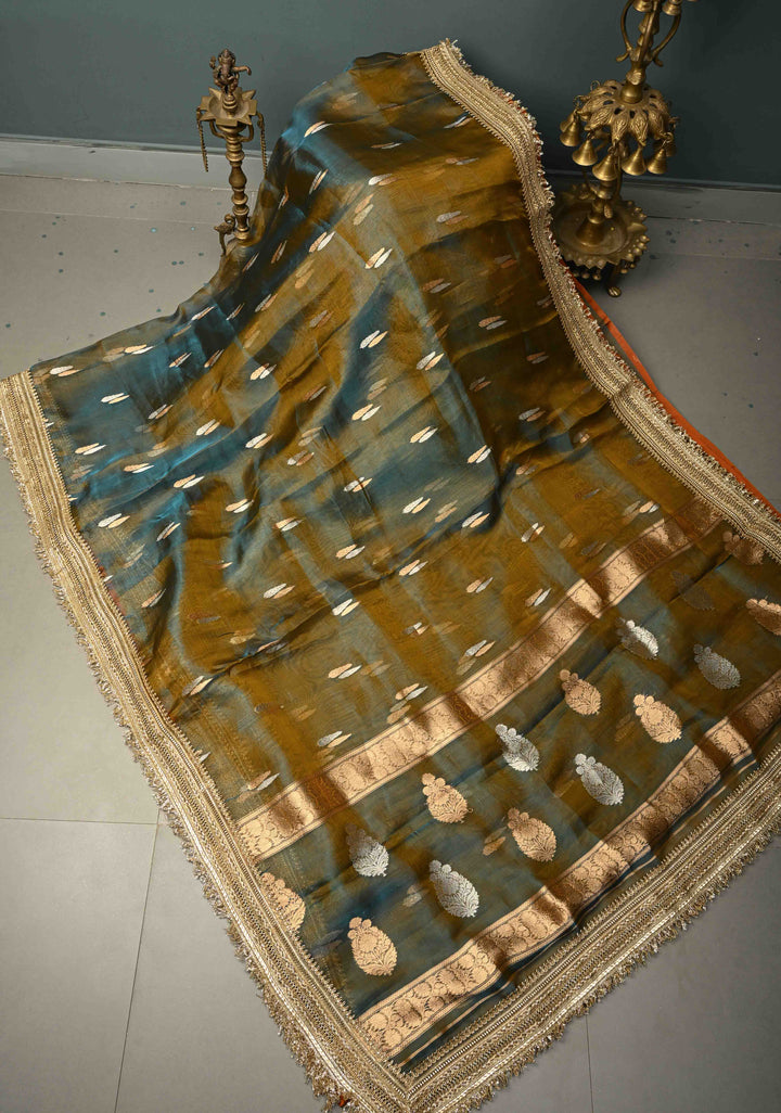 Mustard-Blue Dual tone Organza Silk Saree with Sona Rupa Zari Buttas and Fancy Lace Trim Border | SILK MARK CERTIFIED | SHOBITAM