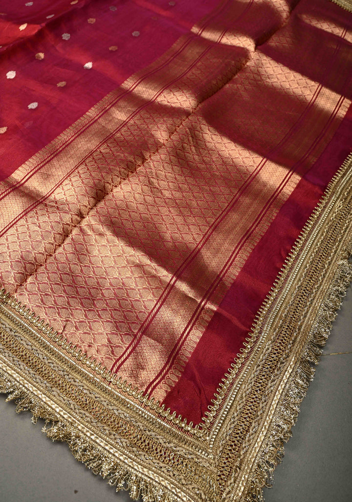 Pink-Maroon Dual Tone Pure Banarasi Organza Tissue Silk Saree with Sona Rupa Floral Zari Buttas and Fancy Trim Lace Border| SILK MARK CERTIFIED | SHOBITAM