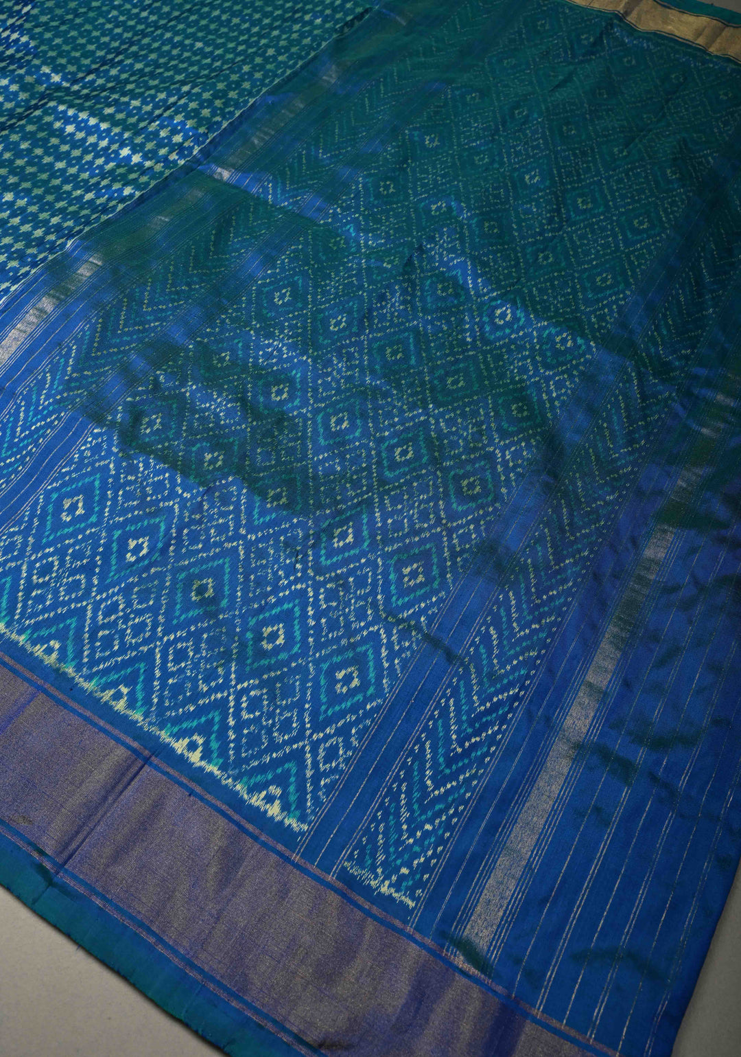 Blue-Green Dual tone Pochampally Ikkat Pure Silk Saree with Twill Design and Nandi Motifs on Tissue Zari Border  | SILK MARK CERTIFIED | SHOBITAM