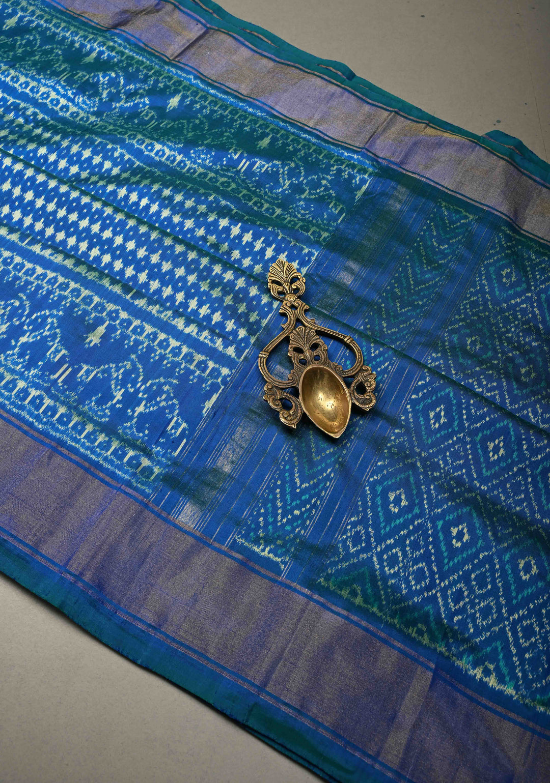Blue-Green Dual tone Pochampally Ikkat Pure Silk Saree with Twill Design and Nandi Motifs on Tissue Zari Border  | SILK MARK CERTIFIED | SHOBITAM